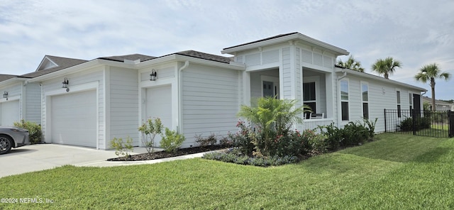 view of property exterior with a garage, concrete driveway, a lawn, and fence