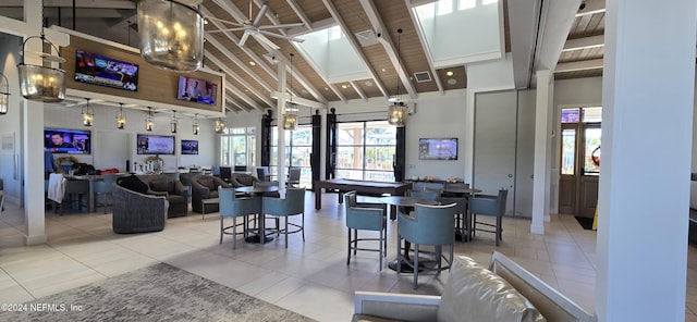 interior space featuring high vaulted ceiling, beamed ceiling, and a wealth of natural light