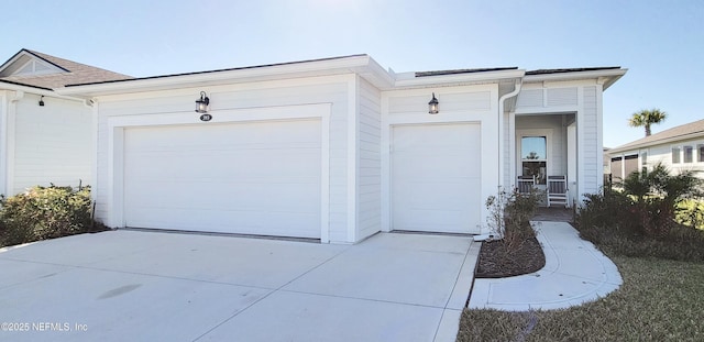 garage featuring driveway