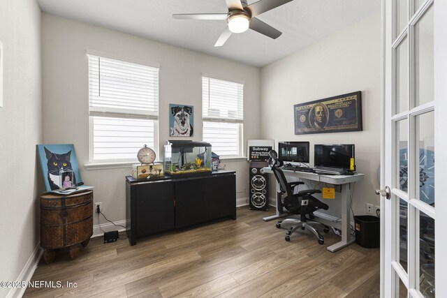 home office featuring ceiling fan, french doors, wood finished floors, and baseboards