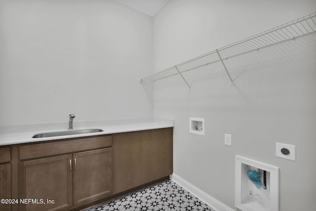 laundry area with hookup for an electric dryer, cabinets, sink, and hookup for a washing machine