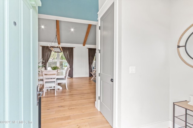 corridor featuring lofted ceiling with beams and light wood-type flooring