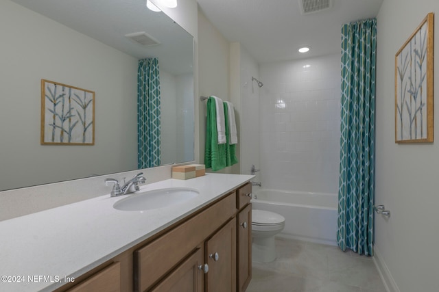 full bathroom with tile patterned floors, vanity, shower / bath combo, and toilet