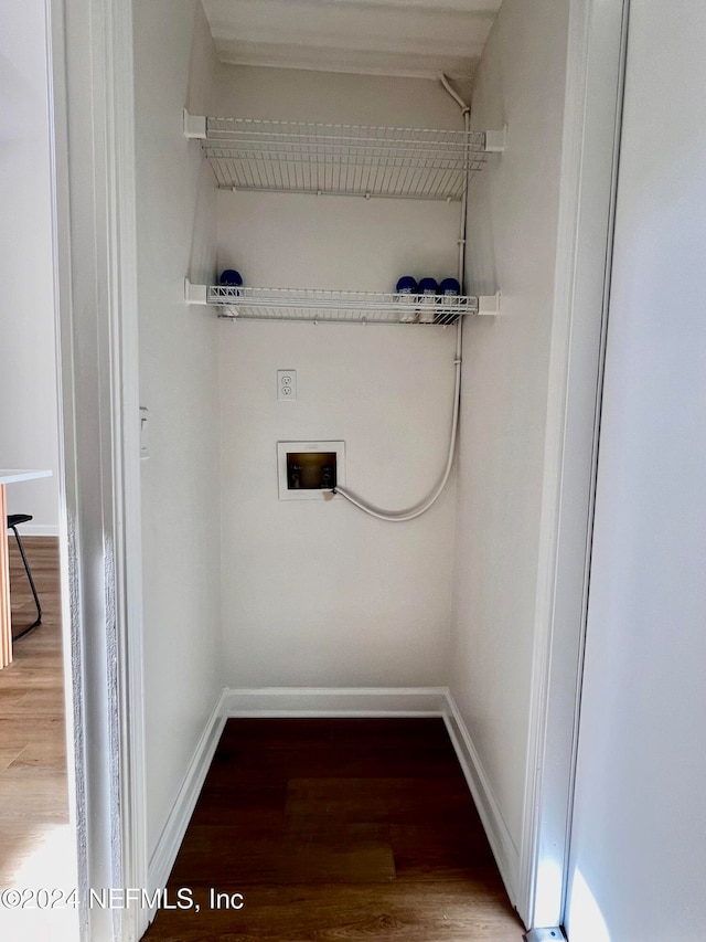 laundry room featuring washer hookup and hardwood / wood-style flooring