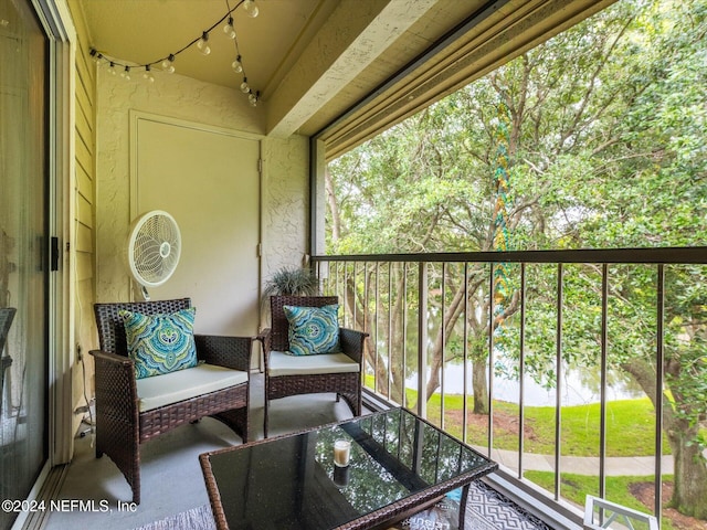 balcony featuring a water view