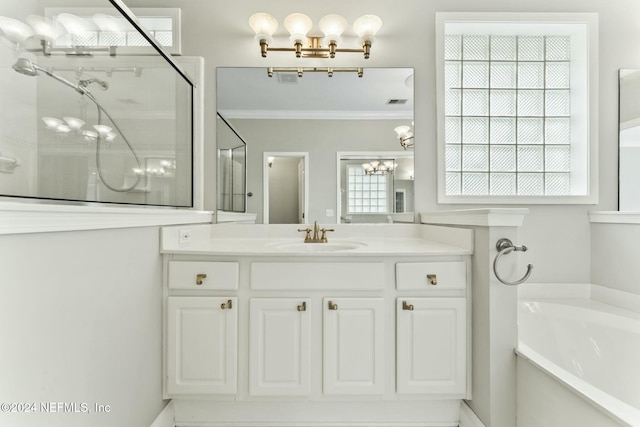 bathroom featuring separate shower and tub, crown molding, and vanity