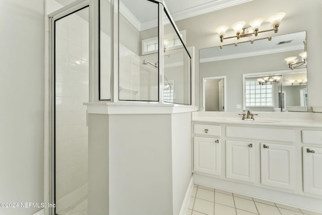 bathroom with tile patterned flooring, vanity, ornamental molding, and walk in shower