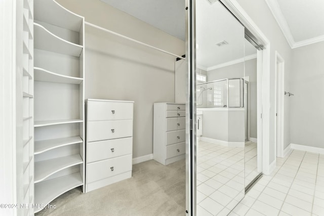 spacious closet featuring light tile patterned floors