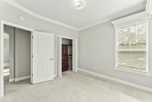 unfurnished bedroom featuring multiple windows, crown molding, and light colored carpet