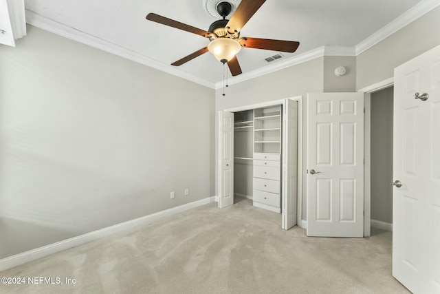 unfurnished bedroom with light carpet, a closet, ceiling fan, and ornamental molding