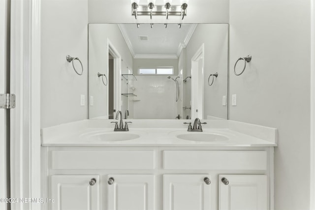 bathroom with a shower, vanity, and crown molding