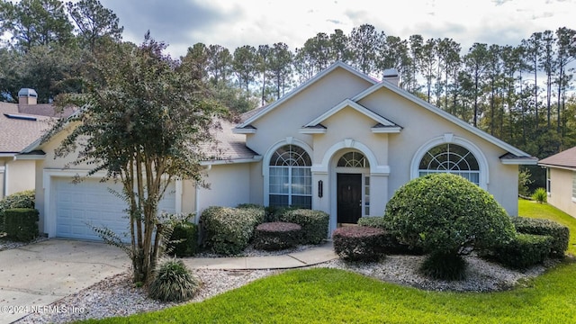 ranch-style home featuring a garage