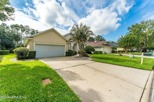 ranch-style home featuring a front lawn and a garage