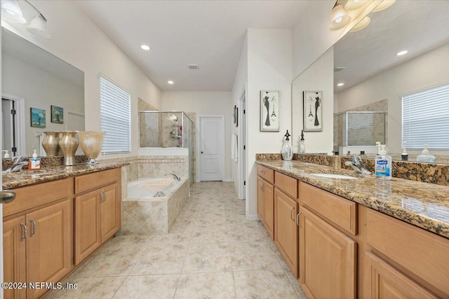 20 Sadie Ct, Saint Augustine, FL 32095 - bathroom featuring a shower stall, two vanities, a garden tub, recessed lighting, and tile patterned floors