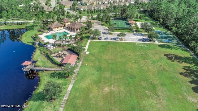 birds eye view of property with a water view