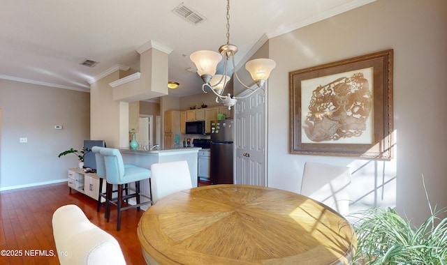 dining area featuring a notable chandelier, crown molding, and dark hardwood / wood-style floors