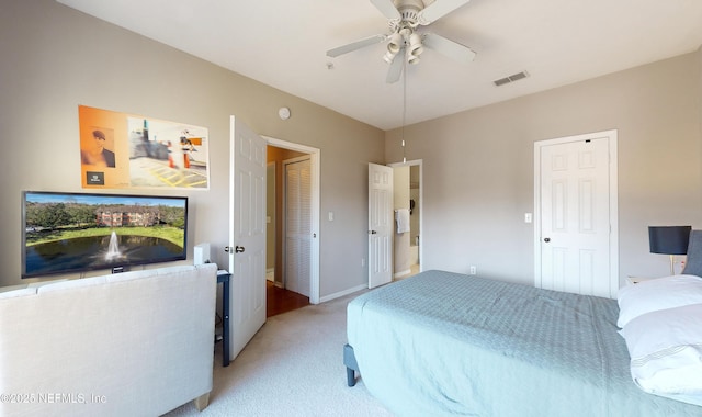 bedroom with light colored carpet and ceiling fan