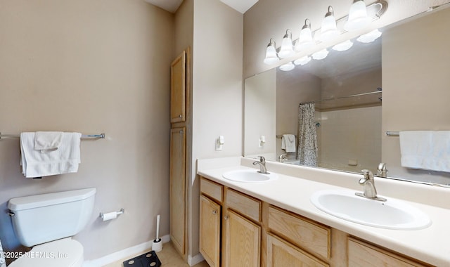 bathroom featuring a shower with curtain, vanity, and toilet