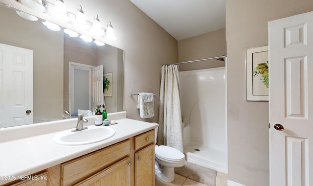 bathroom with a shower with curtain, tile patterned floors, vanity, and toilet