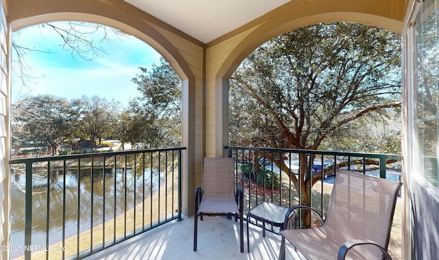 balcony featuring a water view