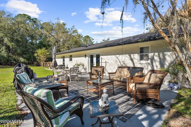 view of patio with outdoor lounge area and french doors