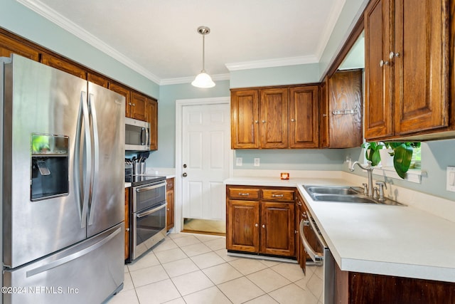 kitchen featuring stainless steel appliances, crown molding, sink, pendant lighting, and light tile patterned floors