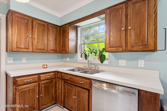 kitchen featuring dishwasher, crown molding, and sink