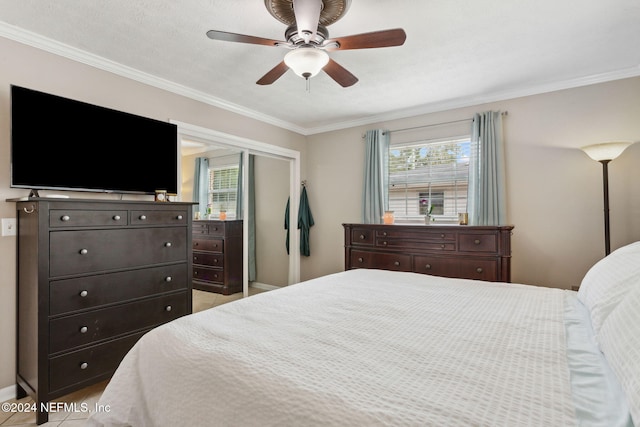 tiled bedroom featuring a textured ceiling, multiple windows, crown molding, and ceiling fan