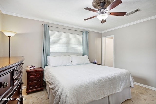 bedroom with ceiling fan, light tile patterned flooring, and ornamental molding