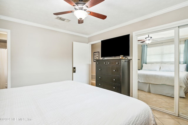 bedroom with ceiling fan, light tile patterned floors, and crown molding