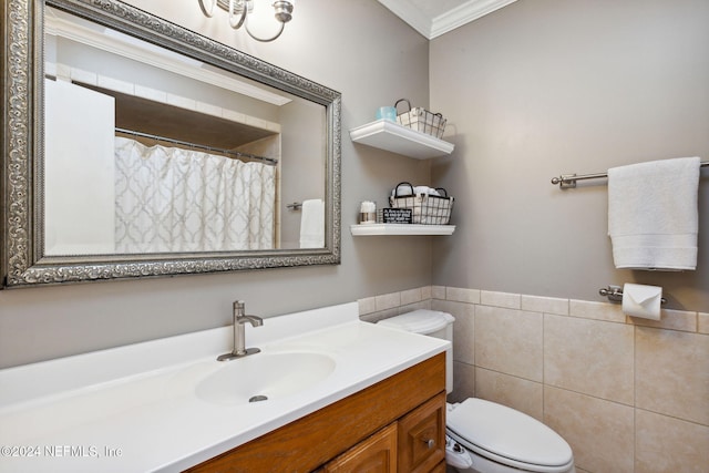 bathroom featuring vanity, toilet, and ornamental molding