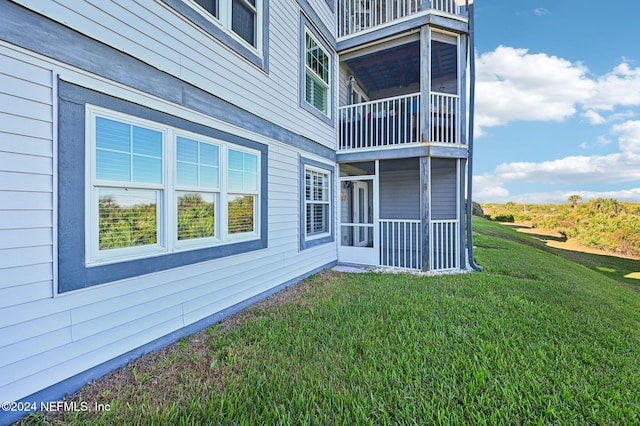 view of home's exterior with a lawn