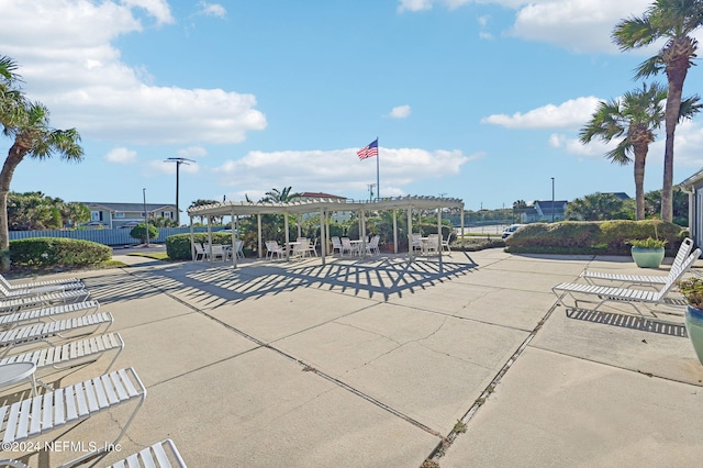 view of community with a pergola and a patio