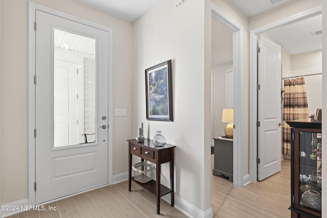 entryway with light hardwood / wood-style flooring