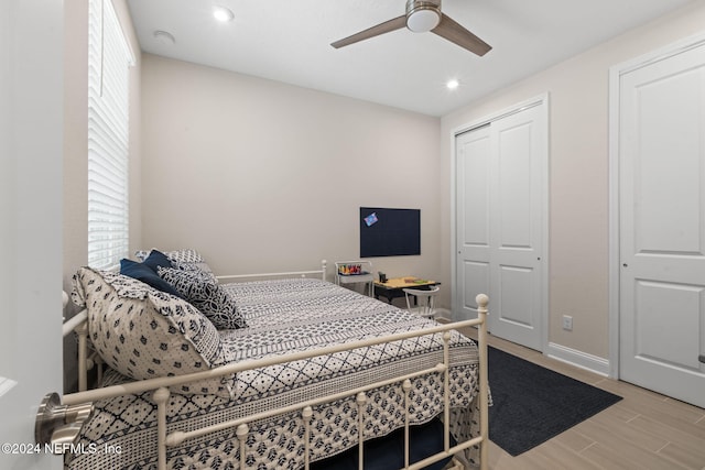 bedroom featuring hardwood / wood-style floors and ceiling fan