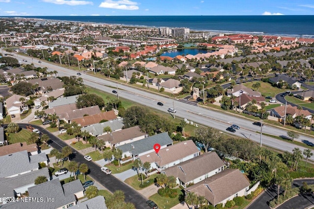 birds eye view of property with a residential view and a water view