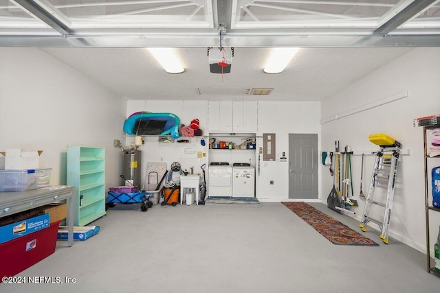 garage with independent washer and dryer, electric water heater, and electric panel