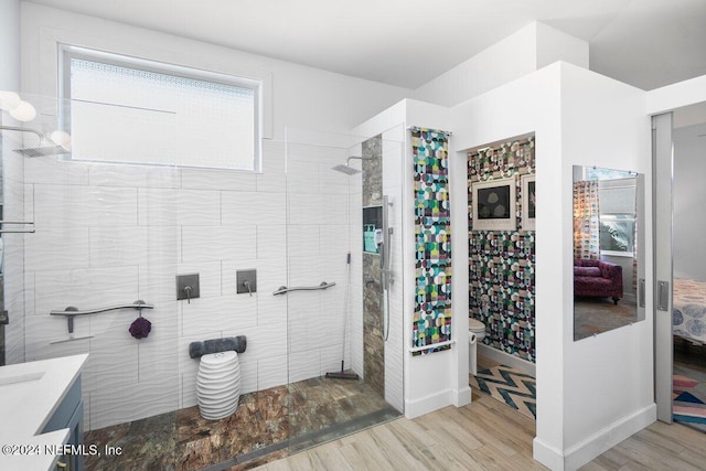 full bath featuring a walk in shower and wood finished floors