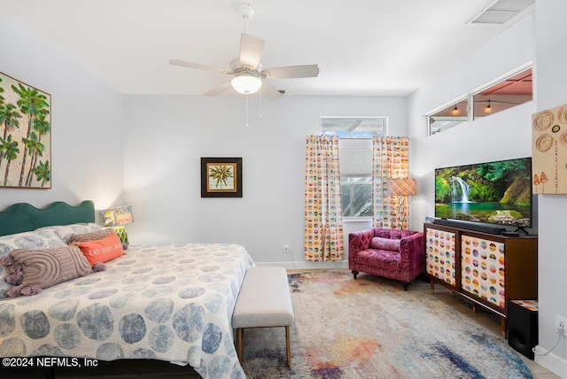 bedroom with ceiling fan and visible vents