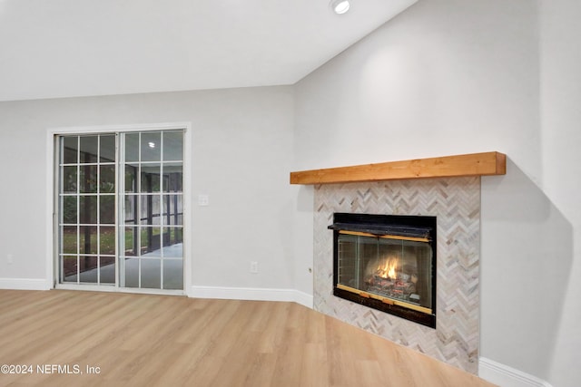 unfurnished living room with hardwood / wood-style floors and a fireplace