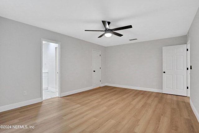 spare room featuring ceiling fan and light hardwood / wood-style flooring