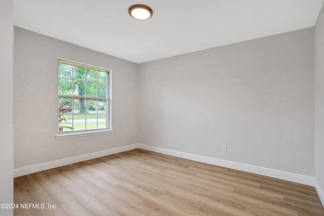 spare room with light hardwood / wood-style floors