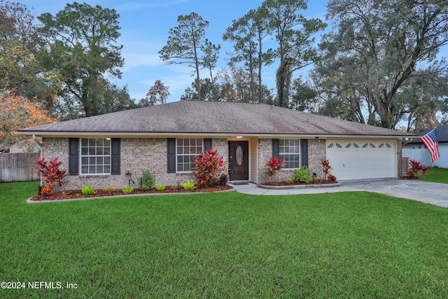 ranch-style home featuring a front yard and a garage