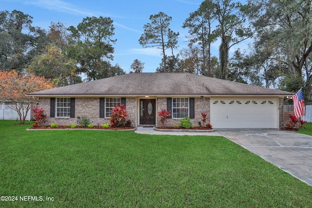 ranch-style house with a front yard and a garage