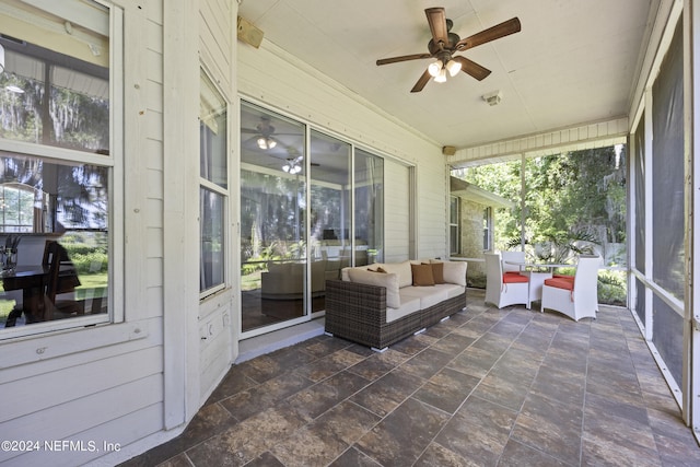 sunroom / solarium with ceiling fan