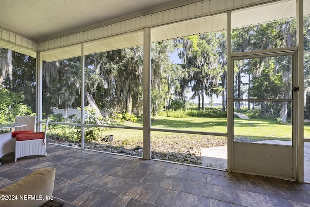 unfurnished sunroom with plenty of natural light