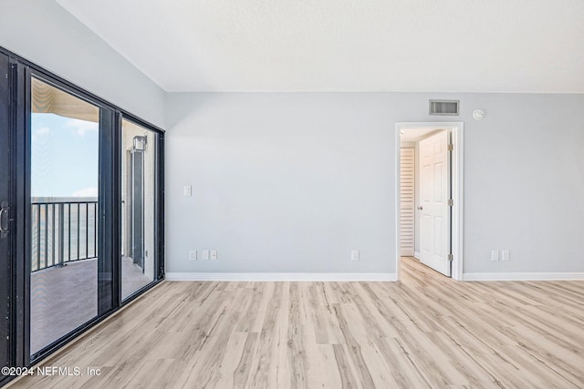 unfurnished room featuring light wood-type flooring