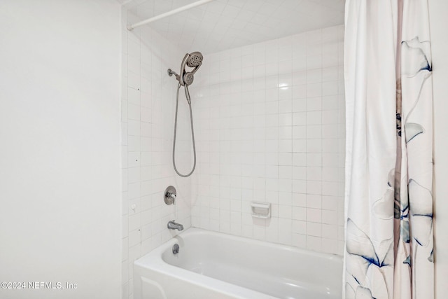 bathroom featuring shower / bath combination with curtain