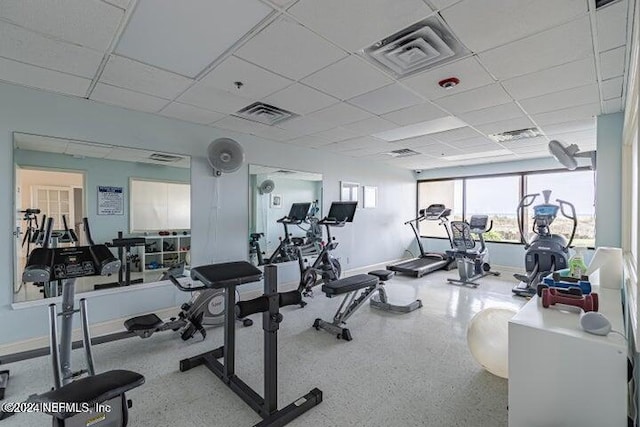 exercise room featuring a drop ceiling