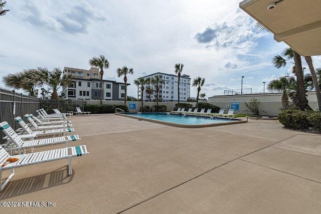 view of swimming pool featuring a patio area